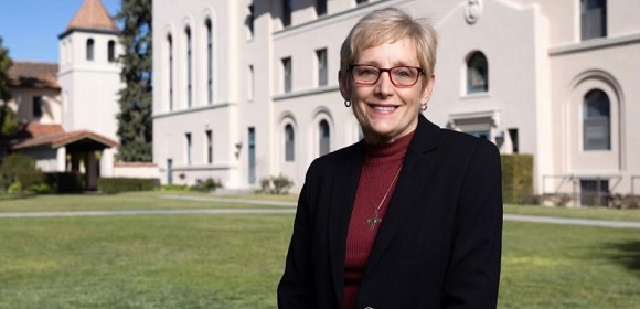 University President Sullivan with St. Joseph's Hall in the background.