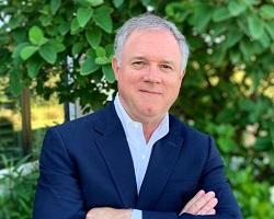 Man in a blue blazer.