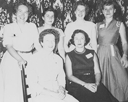 Black and white photo of a group of women.