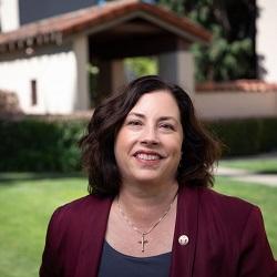 Woman in a maroon blazer.