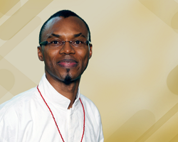 Portrait of a man in a white shirt.