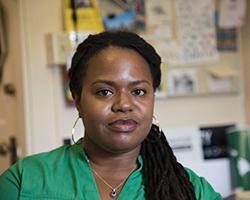 Portrait of a woman in a green blouse.