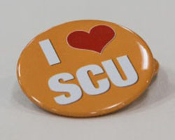 Mustard yellow button with I Love SCU on it.