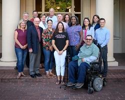 Alumni Board of Directors standing in front of Bannan Alumni House.