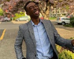 SCU alum Austin Gray smiling.