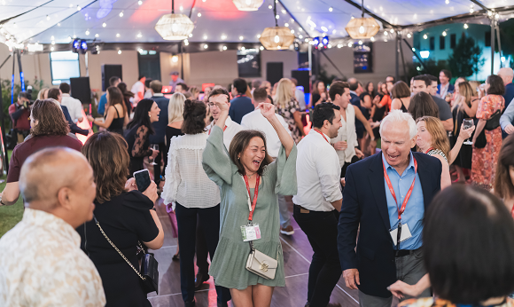 Woman dancing in a crowd.