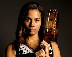 Portrait of a woman holding a musical instrument.