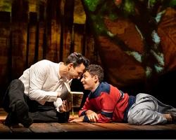 Two actors on the Broadway stage.