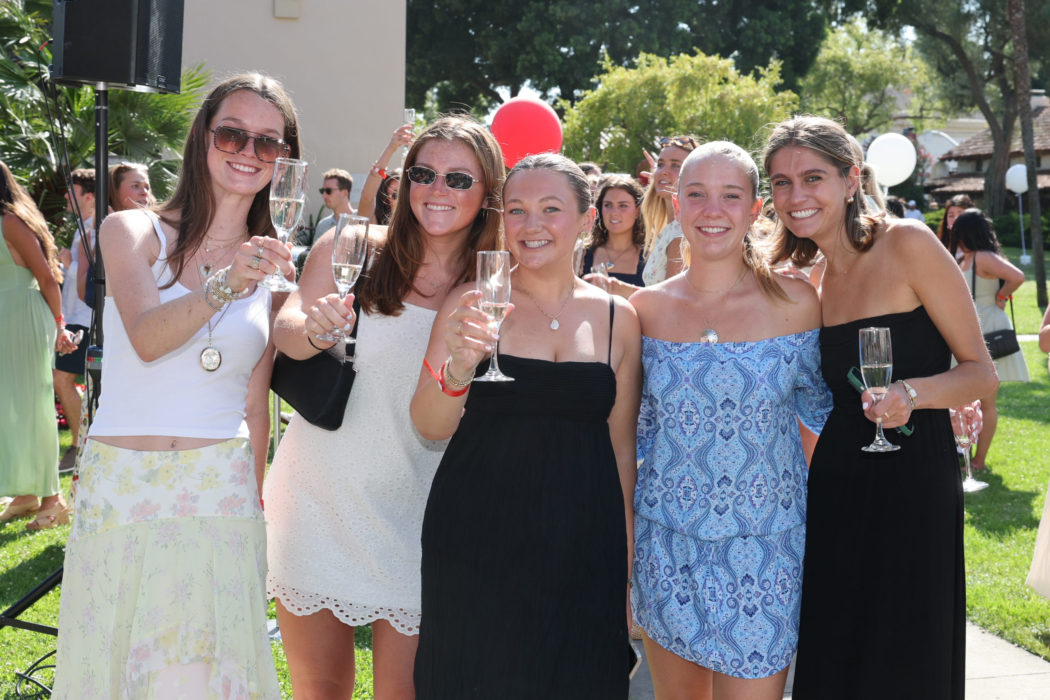 Seniors with glasses at the Class of 2025 Senior Toast