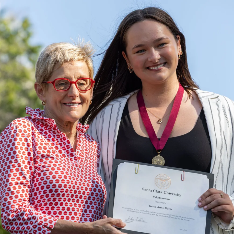University President, Julie Sullivan, presents valedictorian award to Grace Davis ’25. Photo by Dylan Ryu 