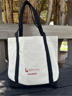 SCU alumni tote bag on a bench