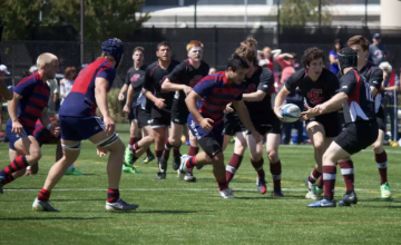 A group of rugby players in action on a field.