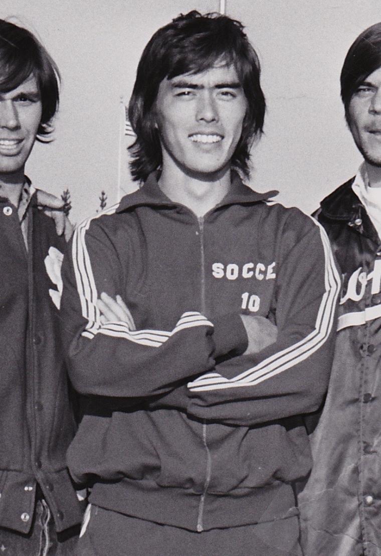 Three people in sports jackets, middle figure labeled Tony Tebbutt.