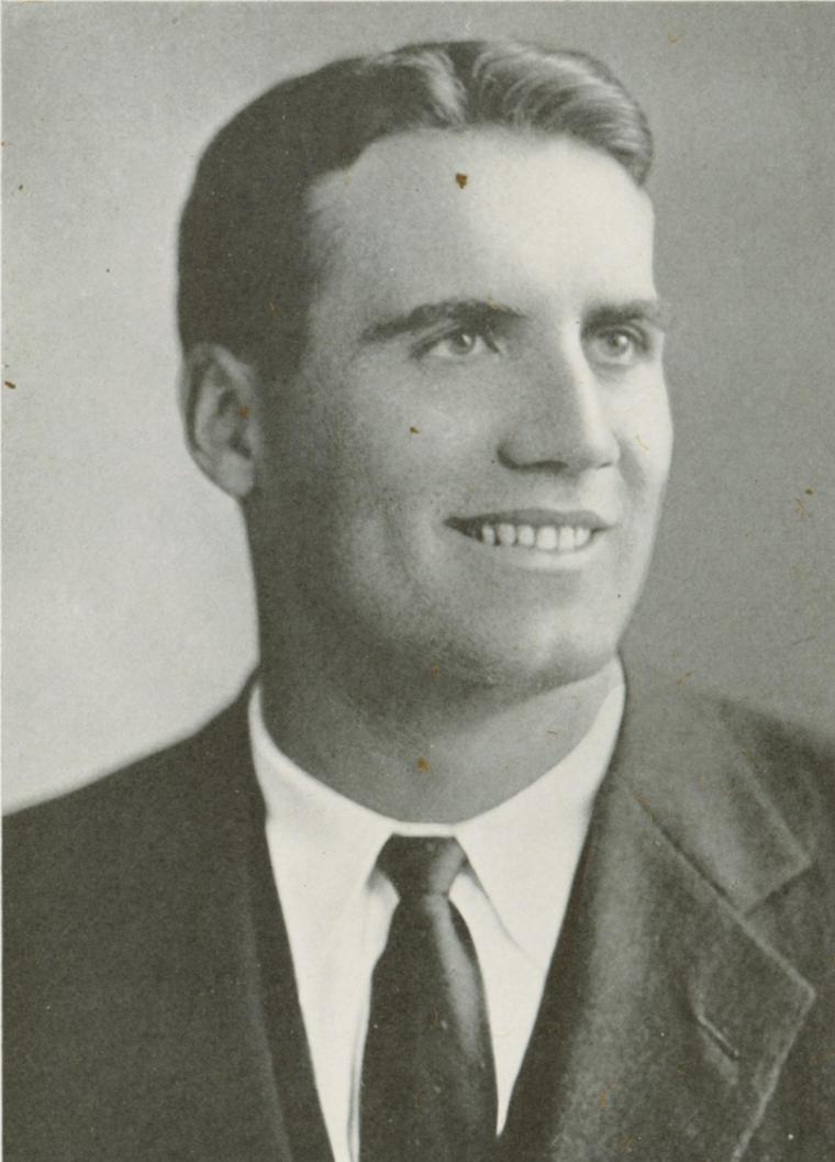 Black and white portrait of a man in a suit and tie.