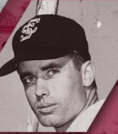 A man in a baseball cap looking at the camera.