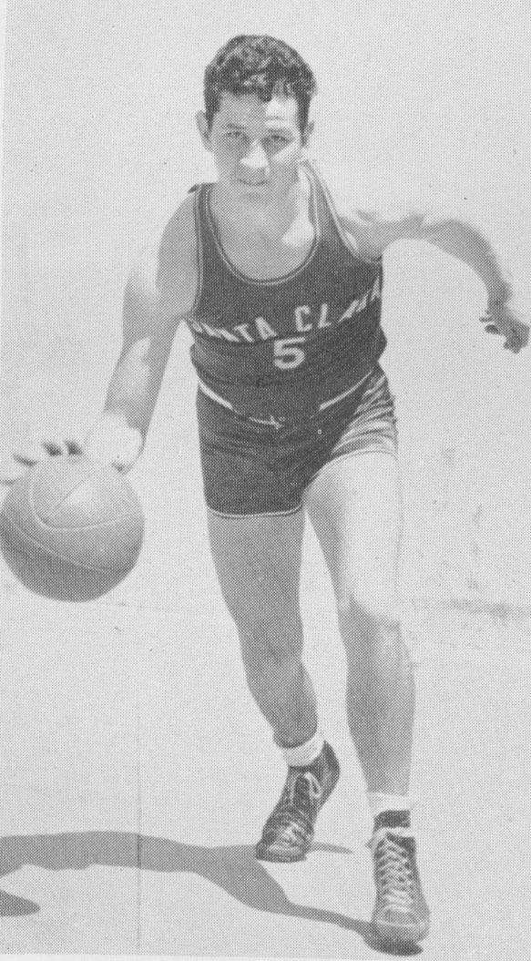 A black-and-white photo of Bob Feerick dribbling a basketball.