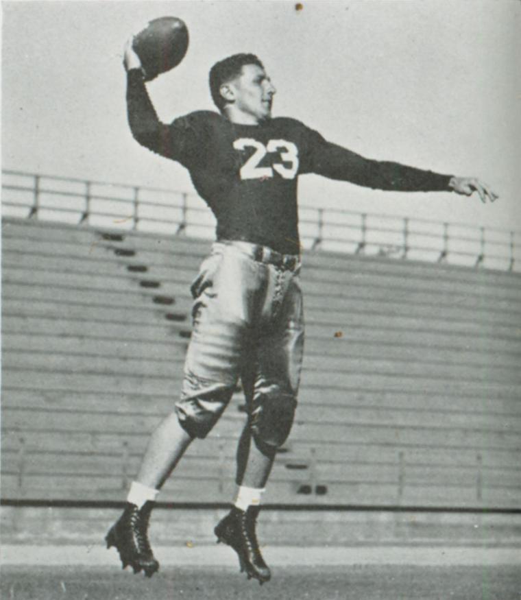 A football player in action wearing a jersey number 22.