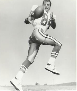 A football player wearing number 84 running with the ball.
