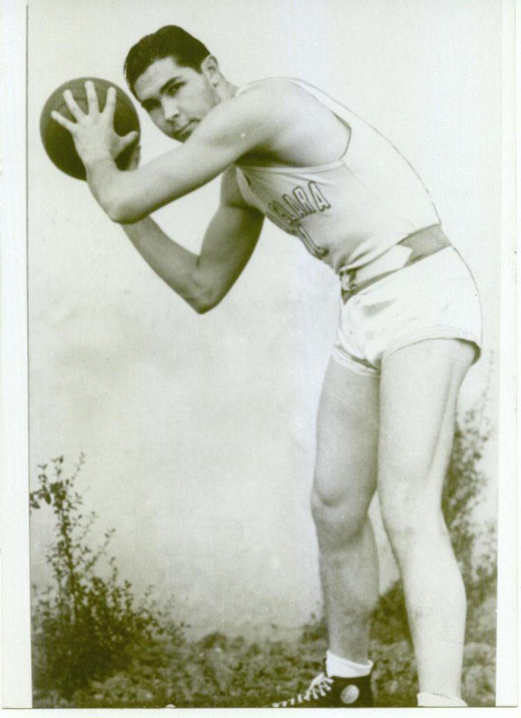 A vintage basketball player holding a basketball, titled Edward Nelson HOF.