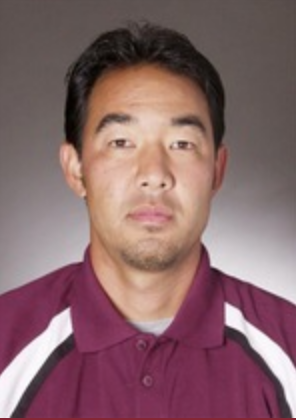 Portrait of Eric Yamamoto in a maroon shirt.