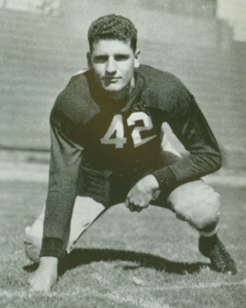 A football player in a stance wearing a number 42 jersey.