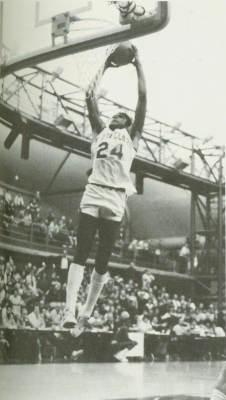 Harold Keeling dunking a basketball during a game in 1985.