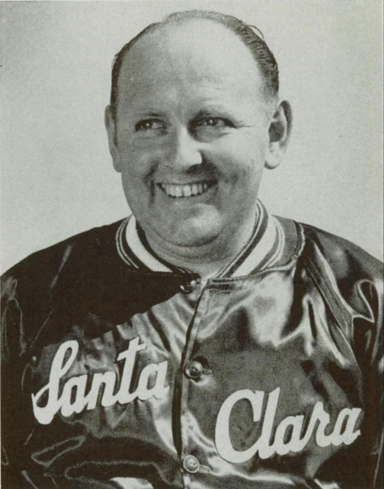A smiling man in a Santa Clara jersey.