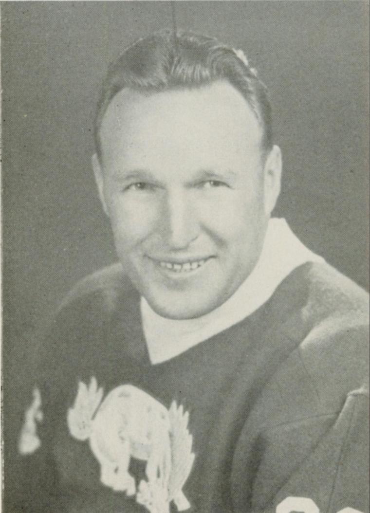 A historical black and white portrait of Herman Meister smiling.