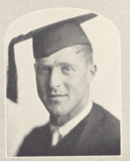 Man in graduation attire and cap.