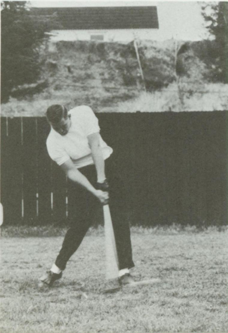 A golfer swinging a club in black and white, 1966.