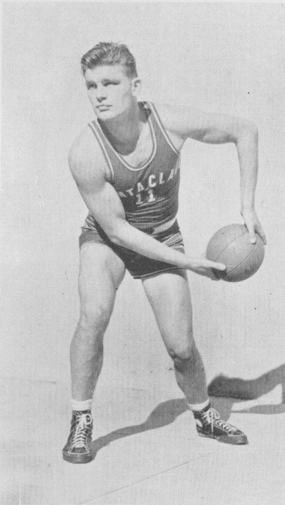 Basketball player James Rickert in uniform, Class of 1942, holding a basketball.