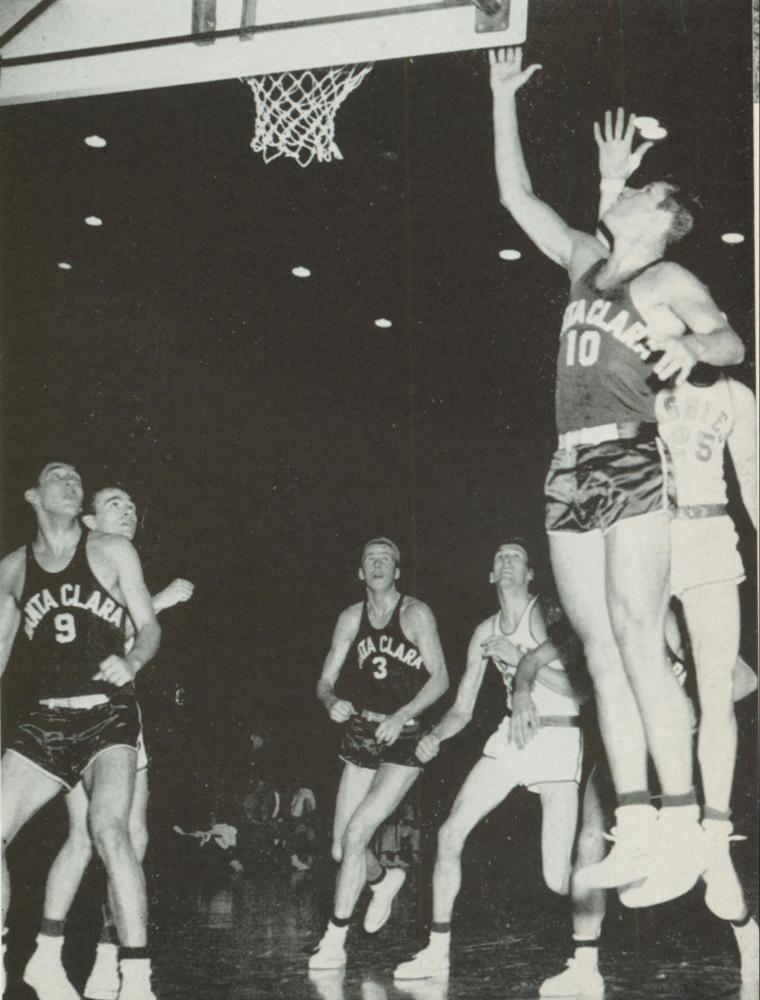 Basketball player making a jump shot in a game, 1954.