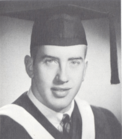 A person in graduation attire and cap.