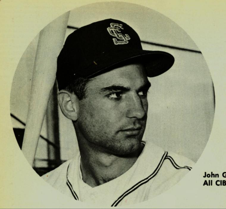 Black and white photo of John Giovanola in a baseball cap.