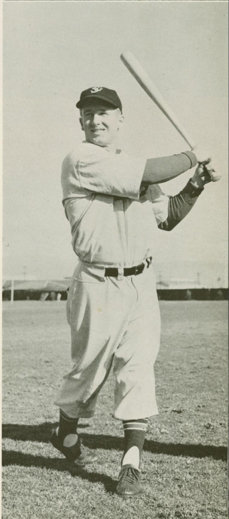 Vintage baseball player swinging a bat.