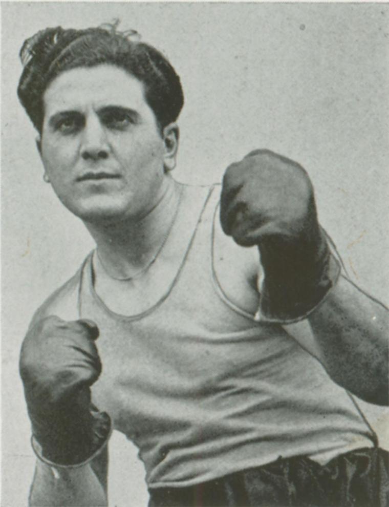 A black and white image of a boxer in a fighting stance.
