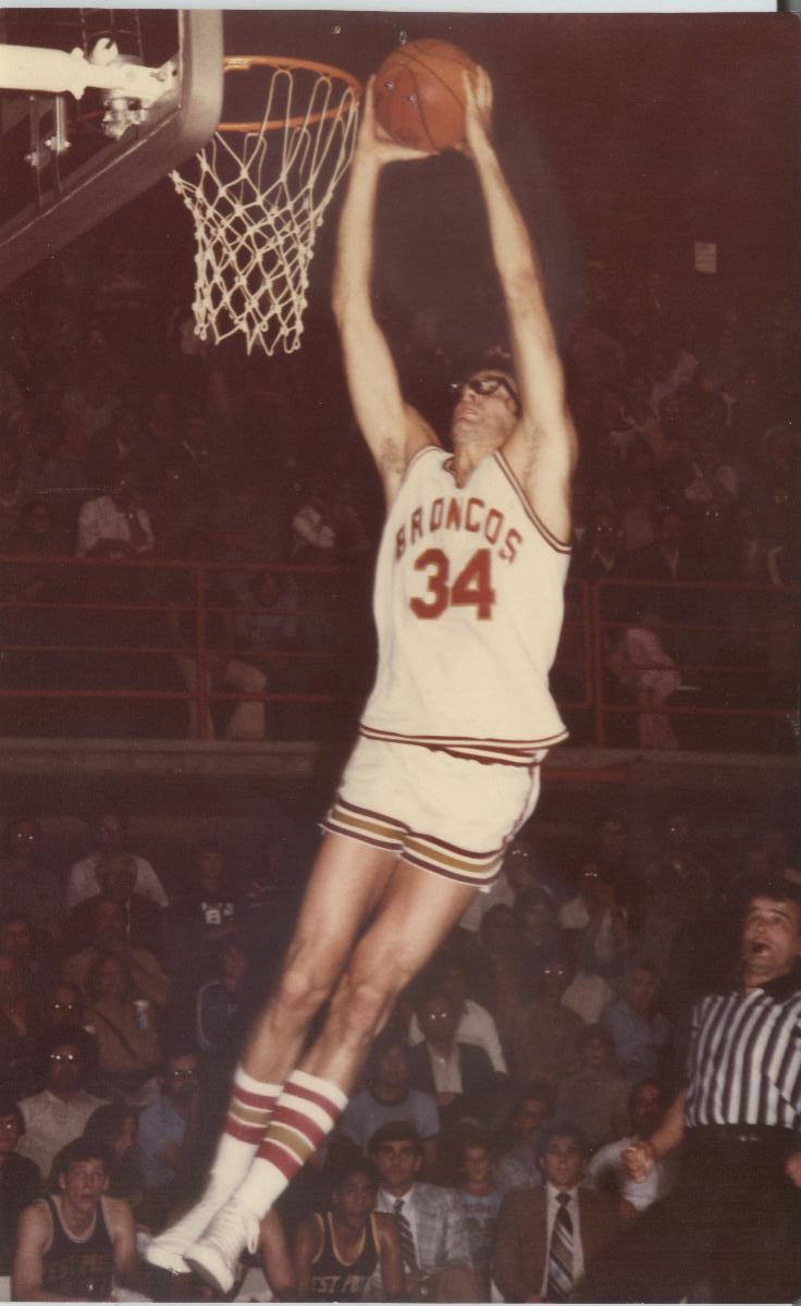 A basketball player wearing jersey number 34 dunking a basketball.