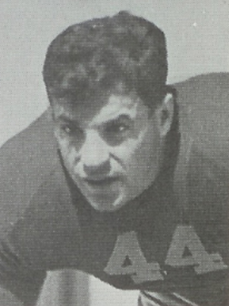 A grayscale image of a football player wearing a jersey with number 44.