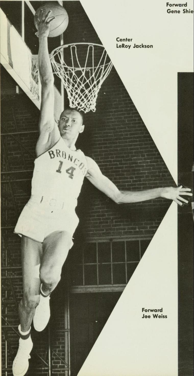 A basketball player jumping to dunk the ball. LeRoy Jackson is written nearby.