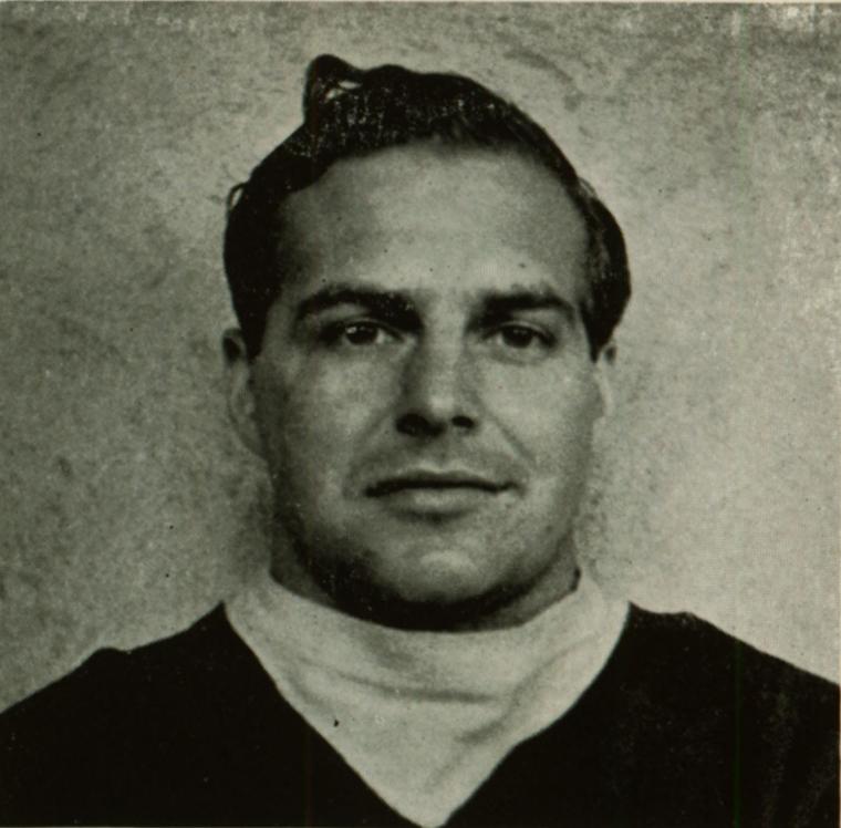 A man in a vintage black and white photograph.