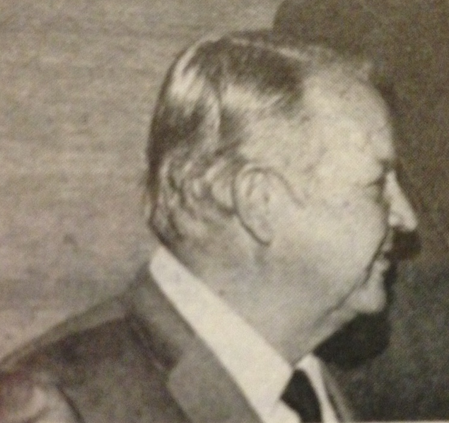 A black-and-white photo of a person in profile.