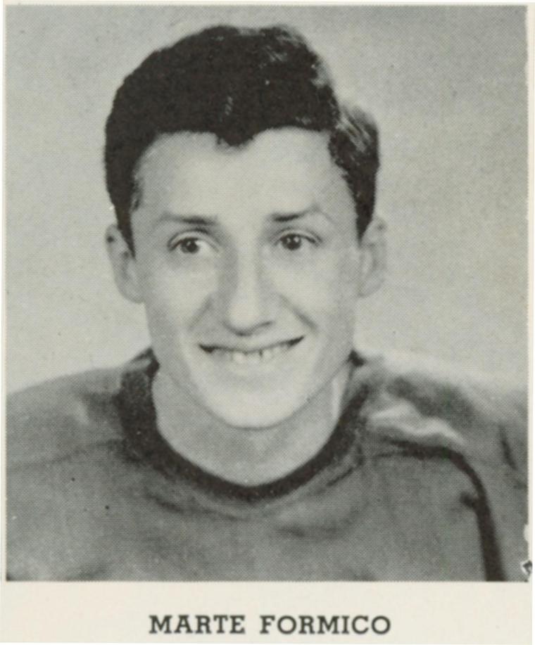 Black and white portrait of Marte Formico wearing a sports jersey.