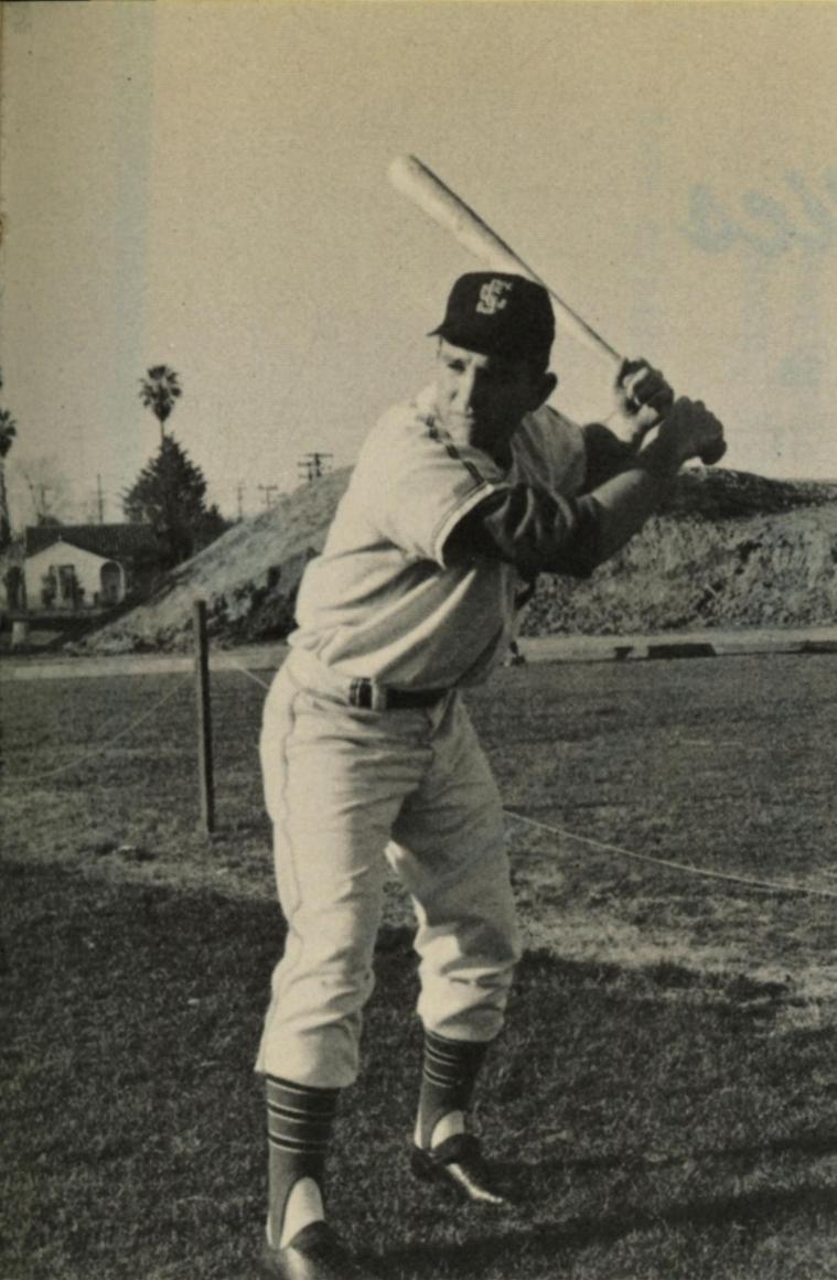 Baseball player in a uniform swinging a bat on a field, 1963.