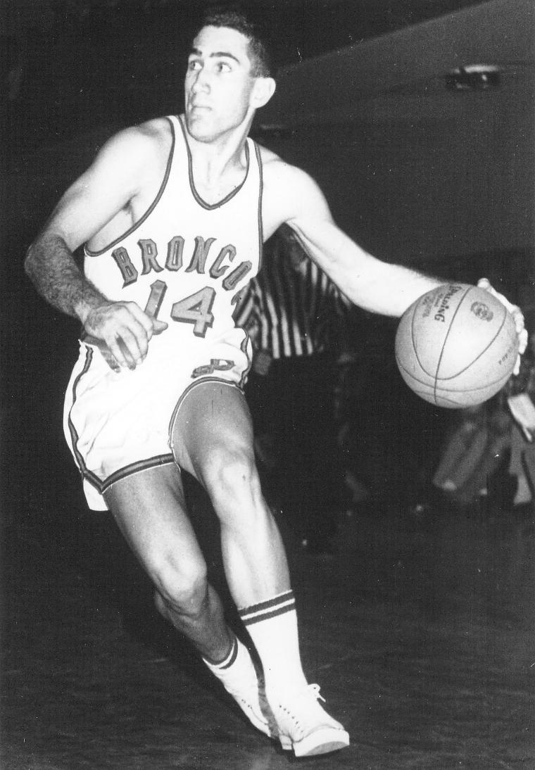 A basketball player in action, labeled Mike Gervasoni HOF.