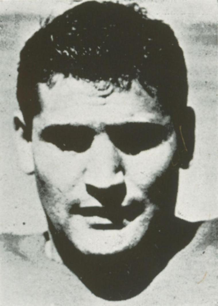 Black and white portrait of man with a serious expression.
