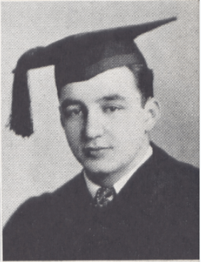 A man in a graduation cap and gown.