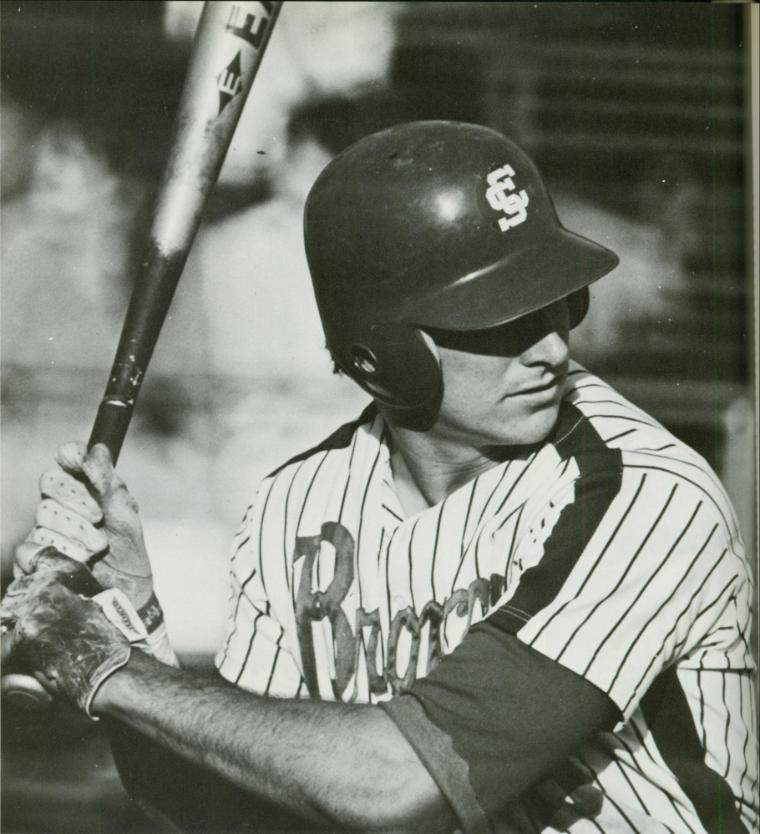 Black and white photo of a baseball player at bat.