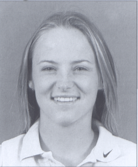 A grayscale portrait of a smiling person.