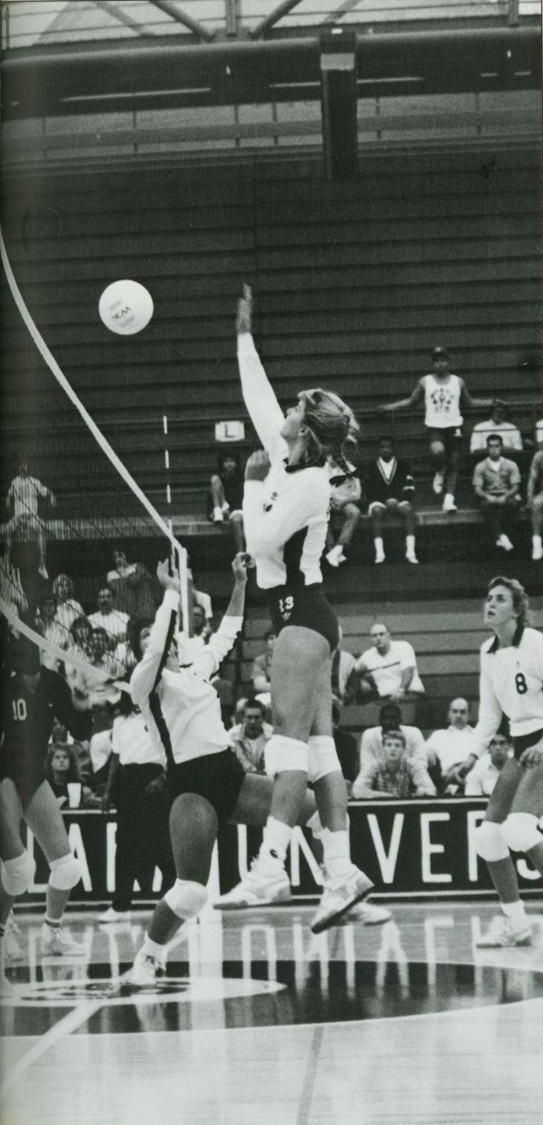 Person jumping to spike a volleyball during a game, 1989.