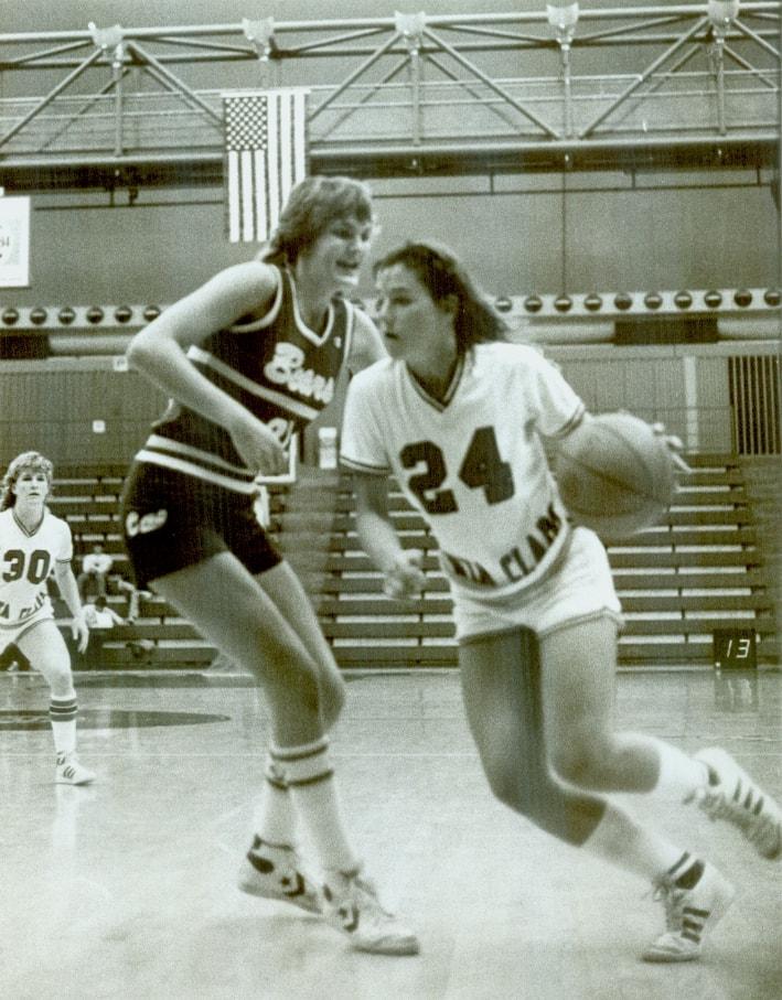 A basketball player wearing jersey number 24 dribbles past a defender.